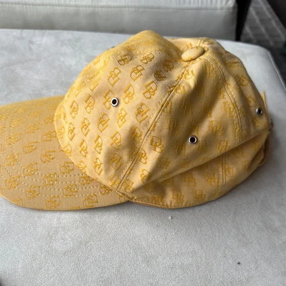 Dooney & Bourke Elegant Yellow Women's Cap with Monogram Design - Picture 2 of 5